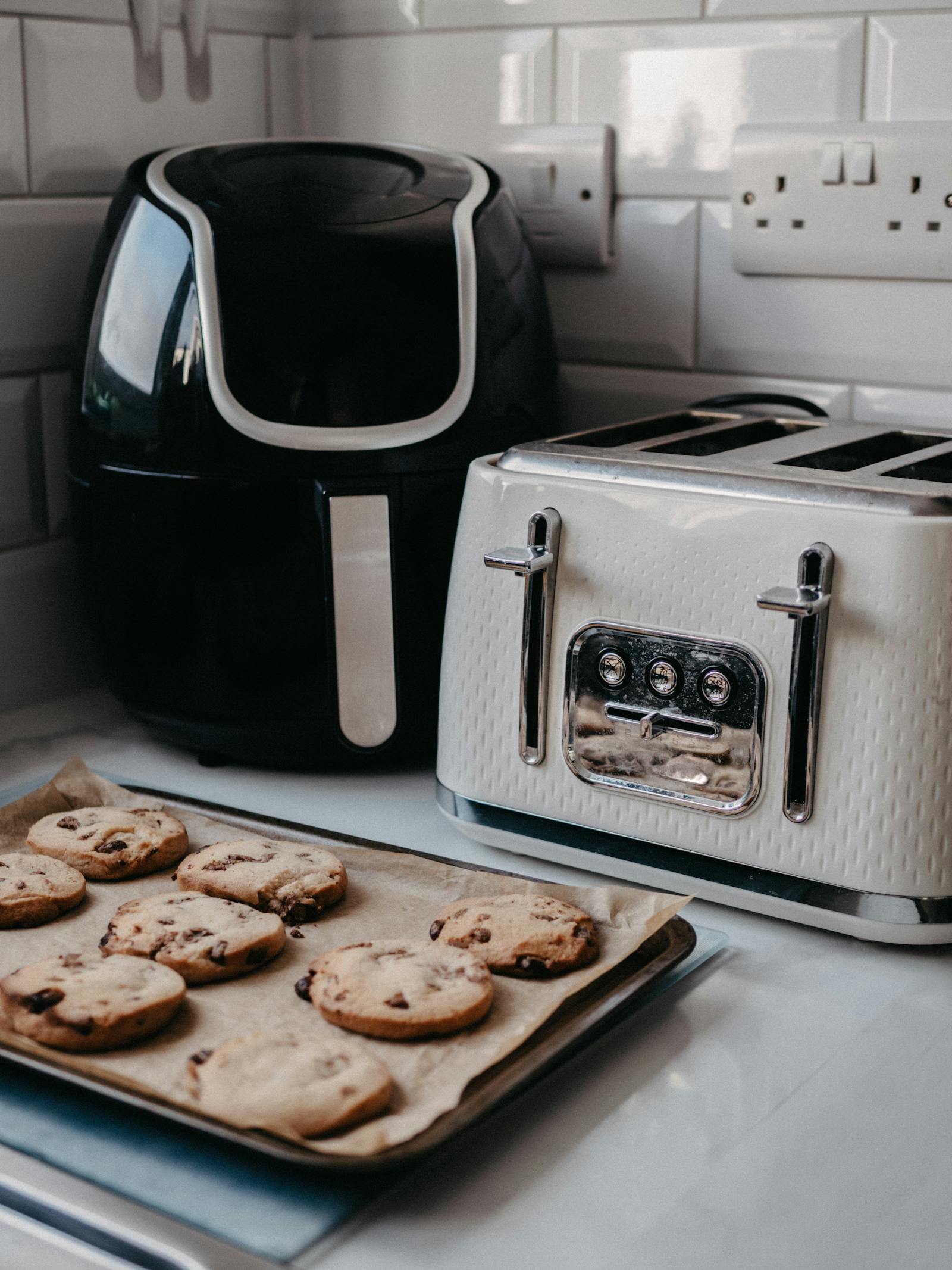 Modern kitchen counter with an air fryer and toaster, representing trendy viral kitchen gadgets tested for real-life usefulness.