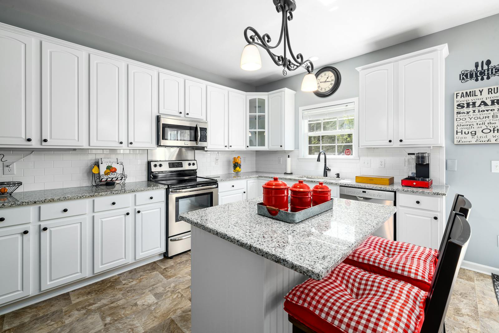 Warm modern kitchen design with earthy tones and natural materials, representing the move away from all-white kitchens in 2026.