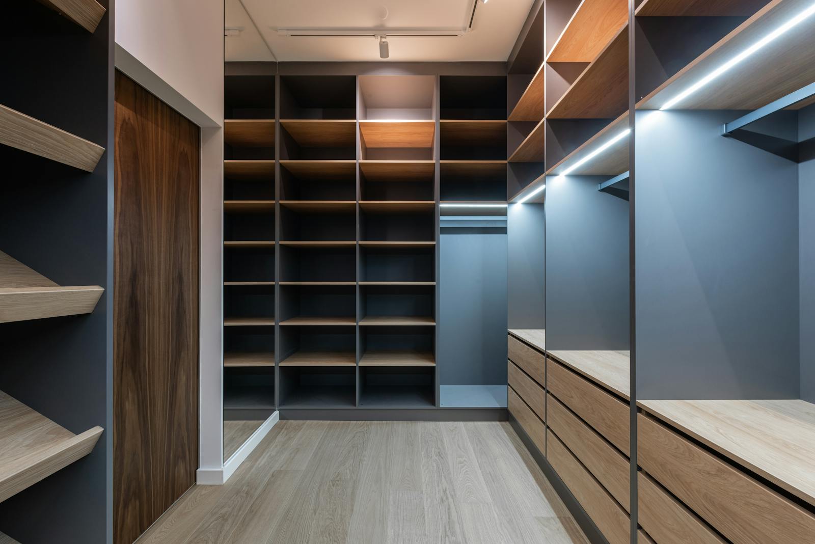 Minimal modern invisible kitchen with hidden appliances, seamless cabinetry, and clean integrated design.