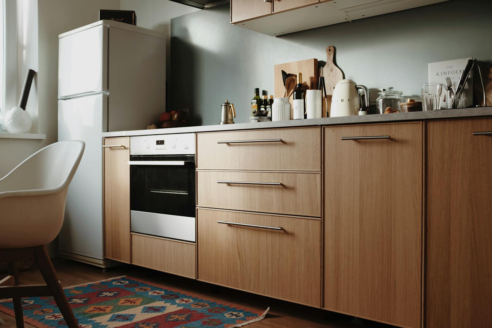 Elegant wooden kitchen cabinetry and modern interior design, illustrating the difference between refined style and cheap-looking luxury mistakes.