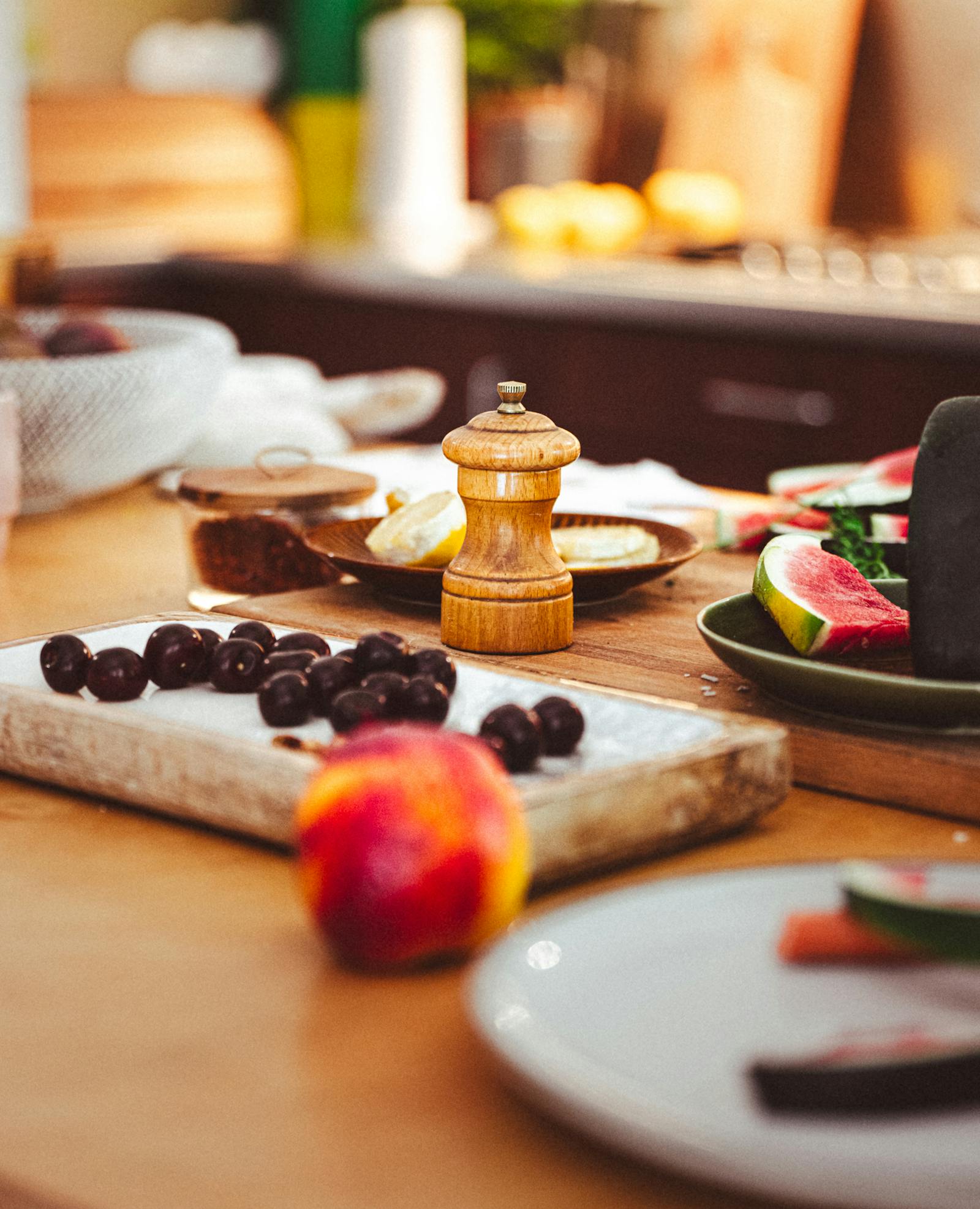 Vibrant kitchen scene with fresh fruit on the counter, representing a kitchen that stays under control through small daily reset habits.