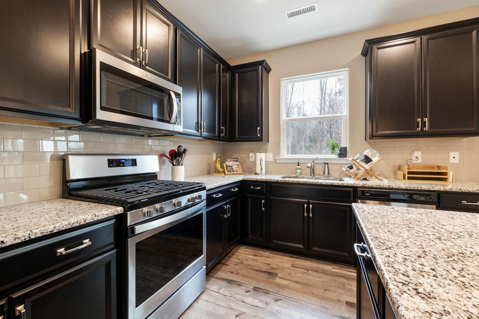 Modern kitchen design with clean cabinetry and hidden storage potential, representing the return of appliance garages in cleaner kitchen layouts.